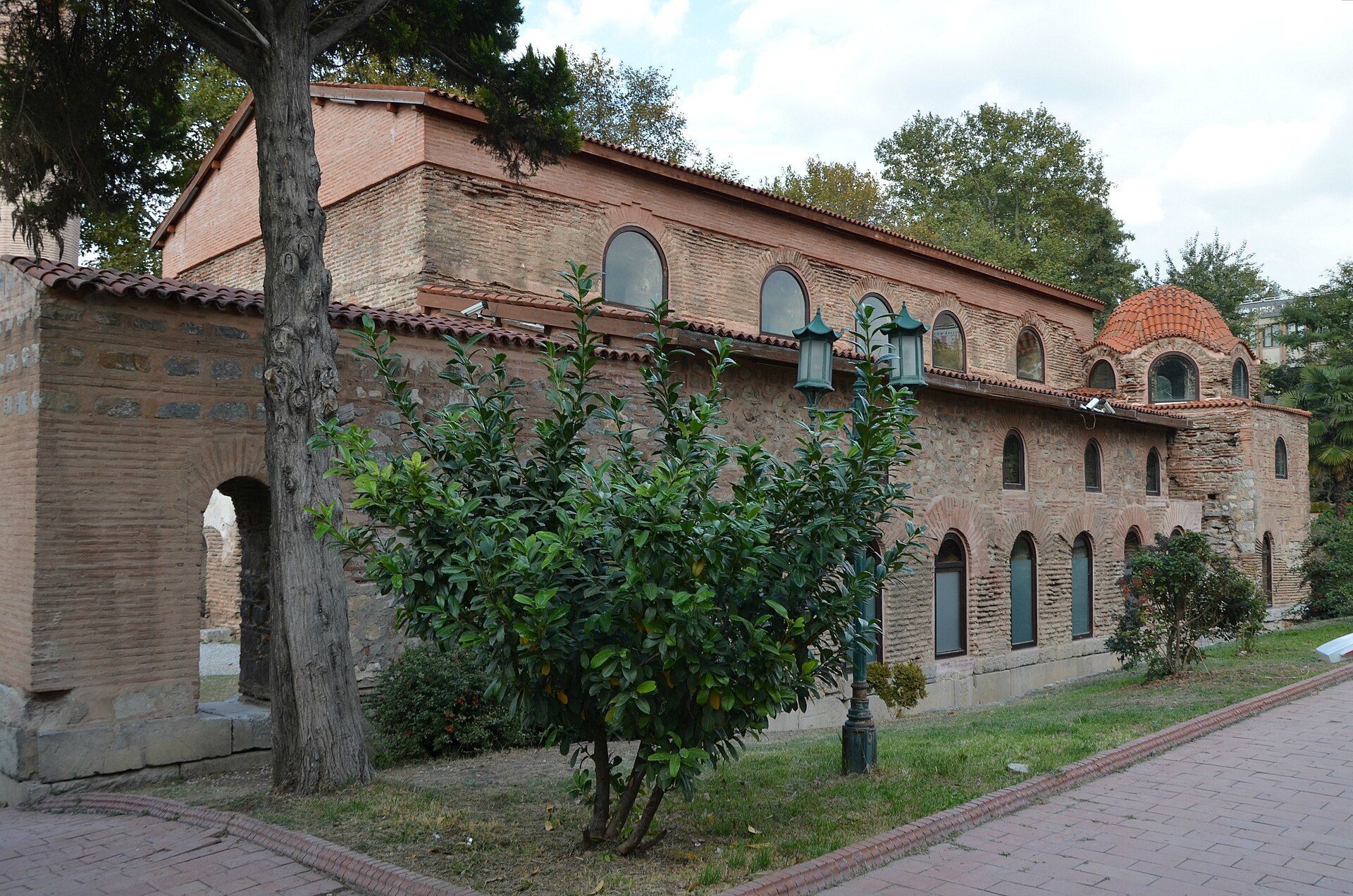 The weathered brick and stone exterior of Hagia Sophia in Nicaea